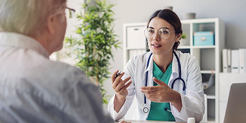 Physician talking to patient
